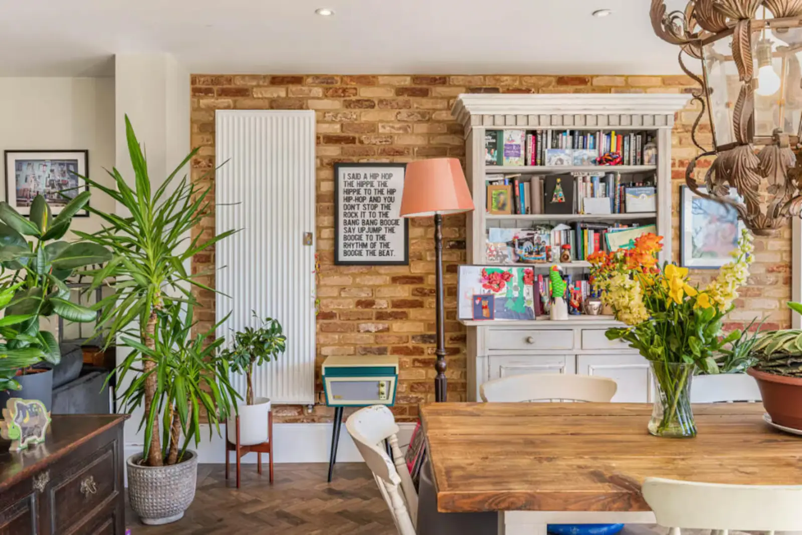 Bromley Retreat dining room with exposed brick and plants